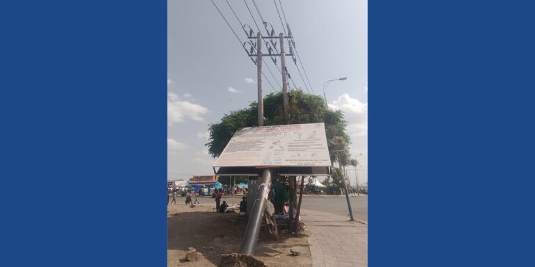 sign taking a break on its pole